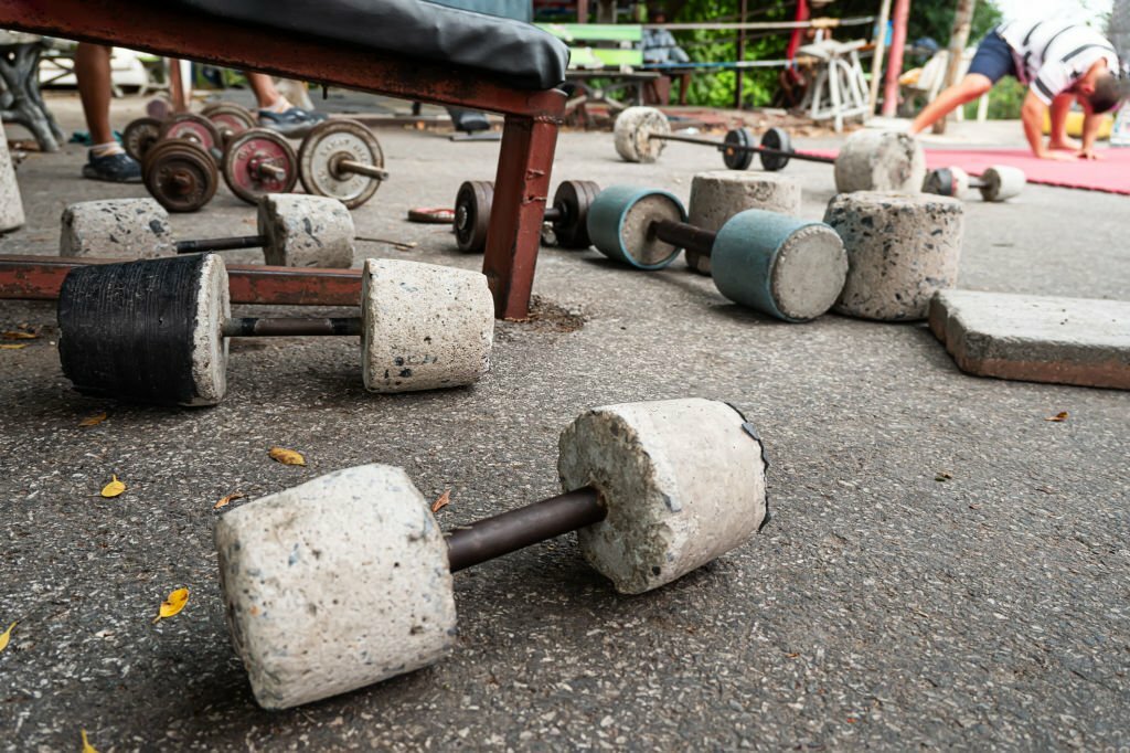 Close of a rustic home made barbells and dumbbells
